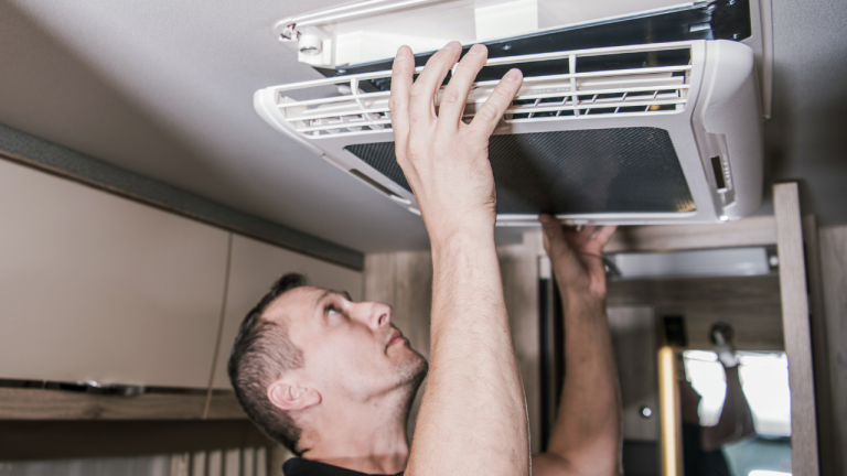 HVAC maintenance and tune-up โ cleaning an indoor air handler filter
