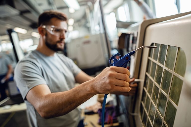 Pleasanton HVAC repair โ technician diagnosing an HVAC unit